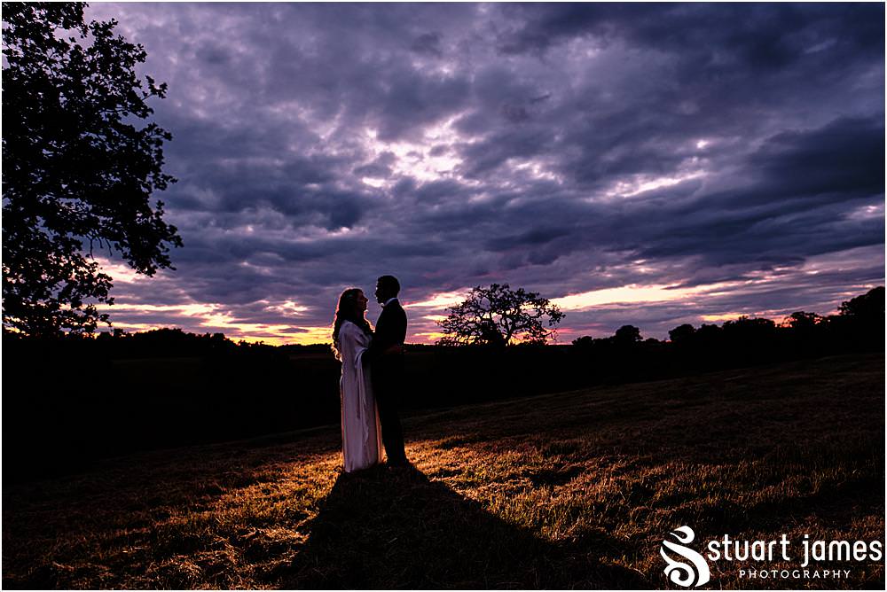 Bride and Groom post for outside portrait at sunset at Davenport House in Shropshire by Davenport House Wedding Photographers Stuart James