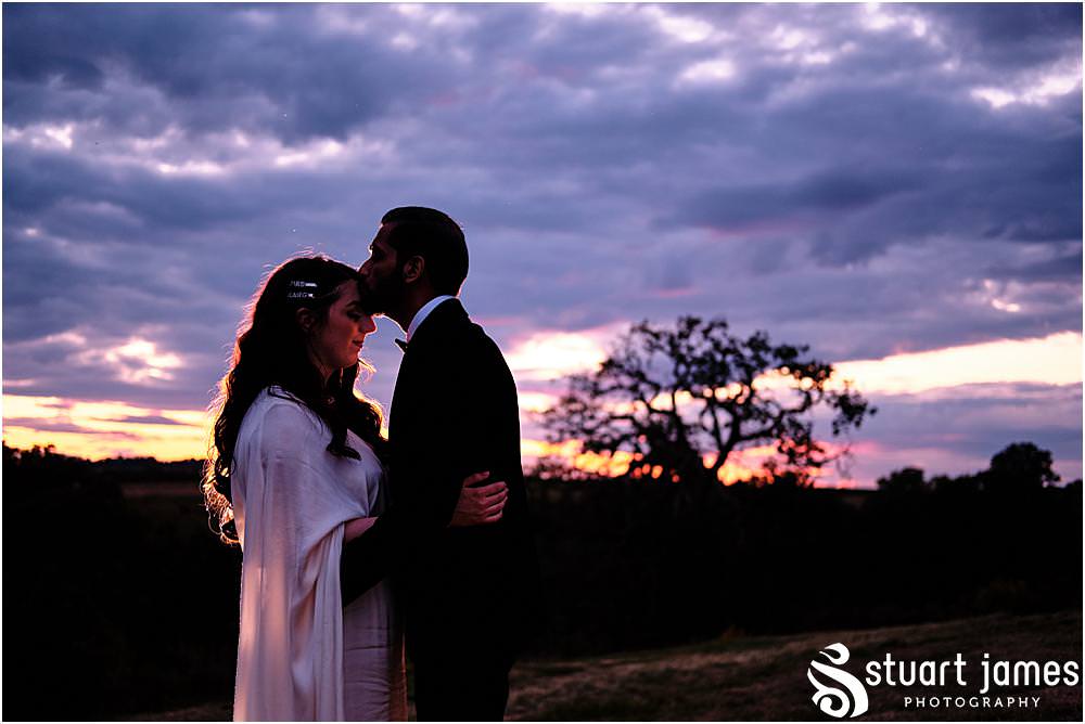 Bride and Groom post for outside portrait at sunset at Davenport House in Shropshire by Davenport House Wedding Photographers Stuart James