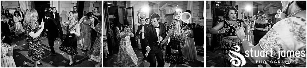 Wedding guests dancing at Davenport House in Shropshire by Davenport House Wedding Photographers Stuart James