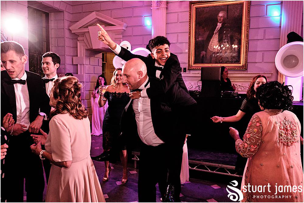Wedding guests dance at Davenport House in Shropshire by Davenport House Wedding Photographers Stuart James