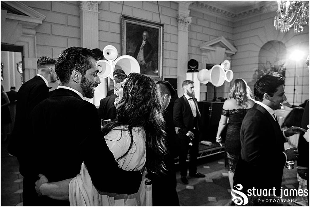 Bride and Groom and wedding guests dance at Davenport House in Shropshire by Davenport House Wedding Photographers Stuart James