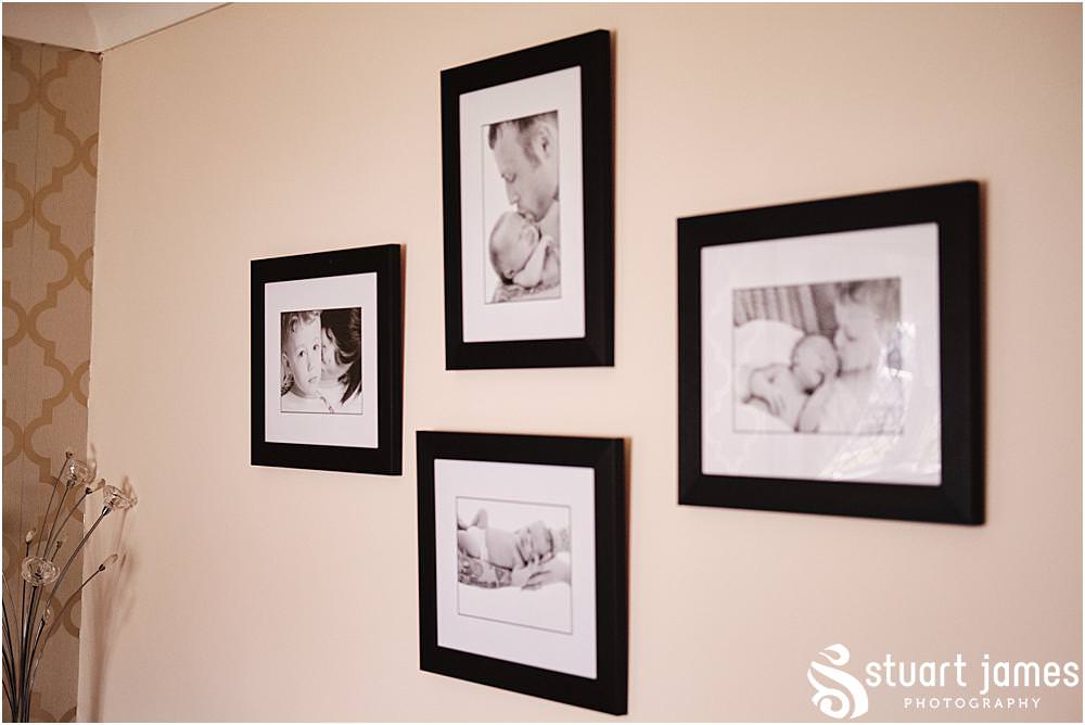 Photo of family pictures hung on a wall before wedding at The Village Hotel, Walsall, photo by Stuart James Photography