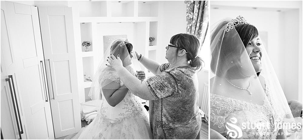 Bride has veil put in hair before wedding at The Village Hotel, Walsall, photo by Stuart James Photography