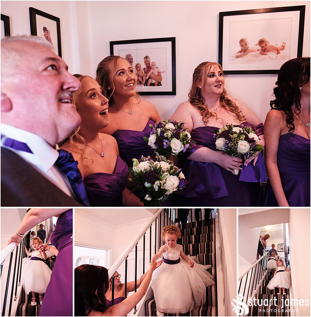 Father of bride see bridesmaids watch flower girls come down the stairs before wedding at The Village Hotel, Walsall, photo by Stuart James Photography