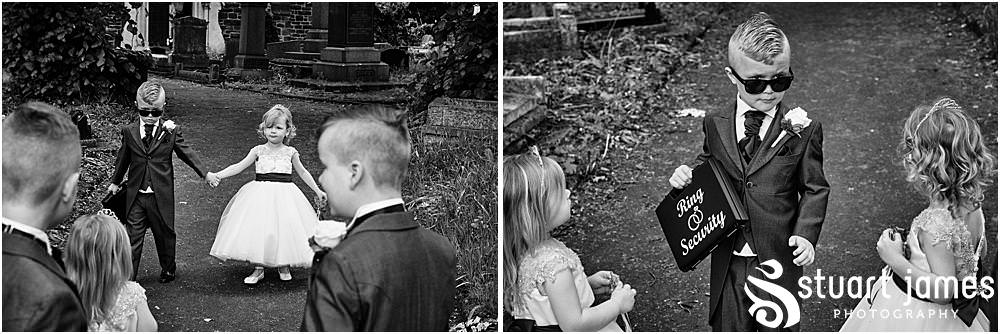 Page Boy and Flower girl hold hands at Holy Trinity Church in Eccleshall, photo by Stuart James Photography at Holy Trinity Church, Eccleshall