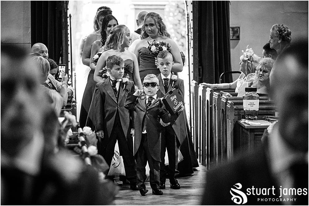 Enter the bridal party at Holy Trinity Church in Eccleshall, photo by Stuart James Photography at Holy Trinity Church, Eccleshall