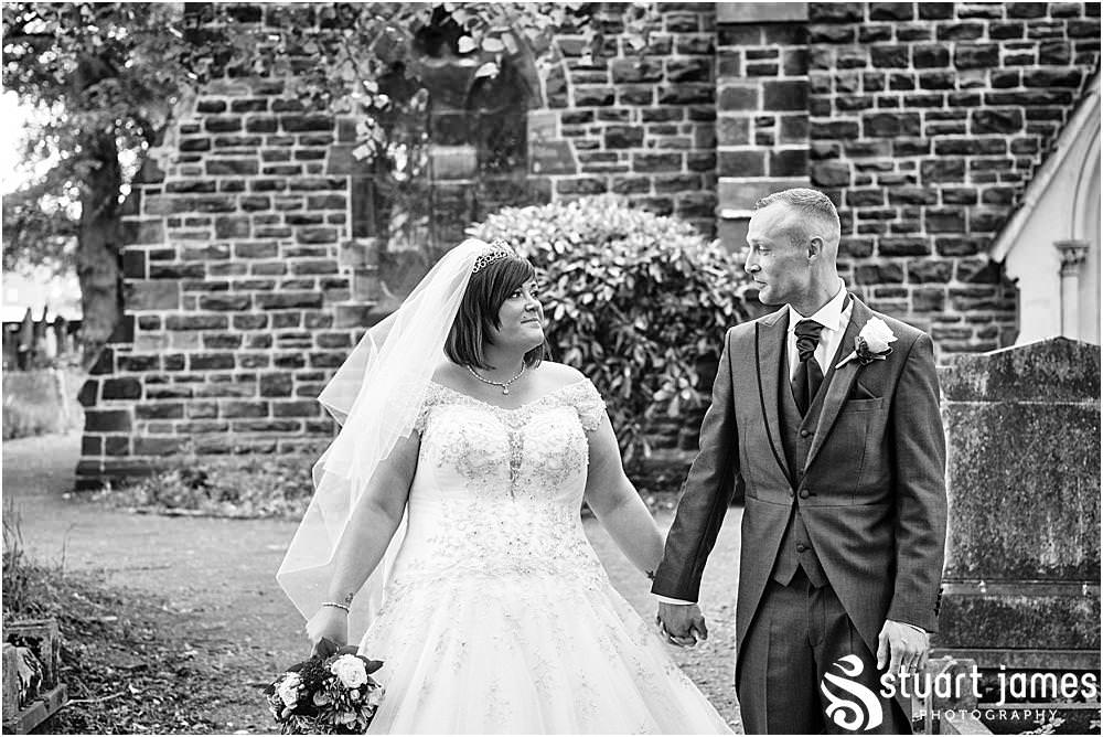 Bride and Groom pose for outside portraits at Holy Trinity Church in Eccleshall, photo by Stuart James Photography at Holy Trinity Church, Eccleshall