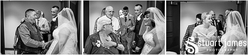 Bride and Groom greet wedding guests with drinks at The Village Hotel, Walsall, photo by Stuart James Photography