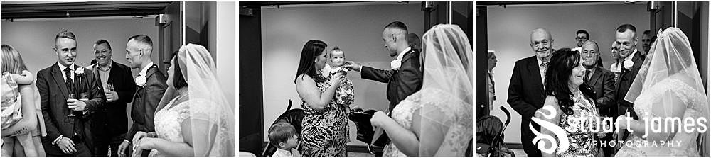 Bride and Groom greet wedding guests with drinks at The Village Hotel, Walsall, photo by Stuart James Photography