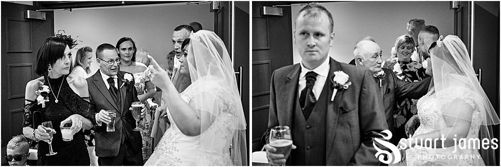 Bride and Groom greet wedding guests with drinks at The Village Hotel, Walsall, photo by Stuart James Photography