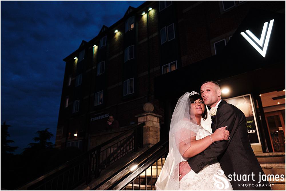 Bride and Groom pose for night time portrait outside The Village Hotel, Walsall, photo by Stuart James Photography