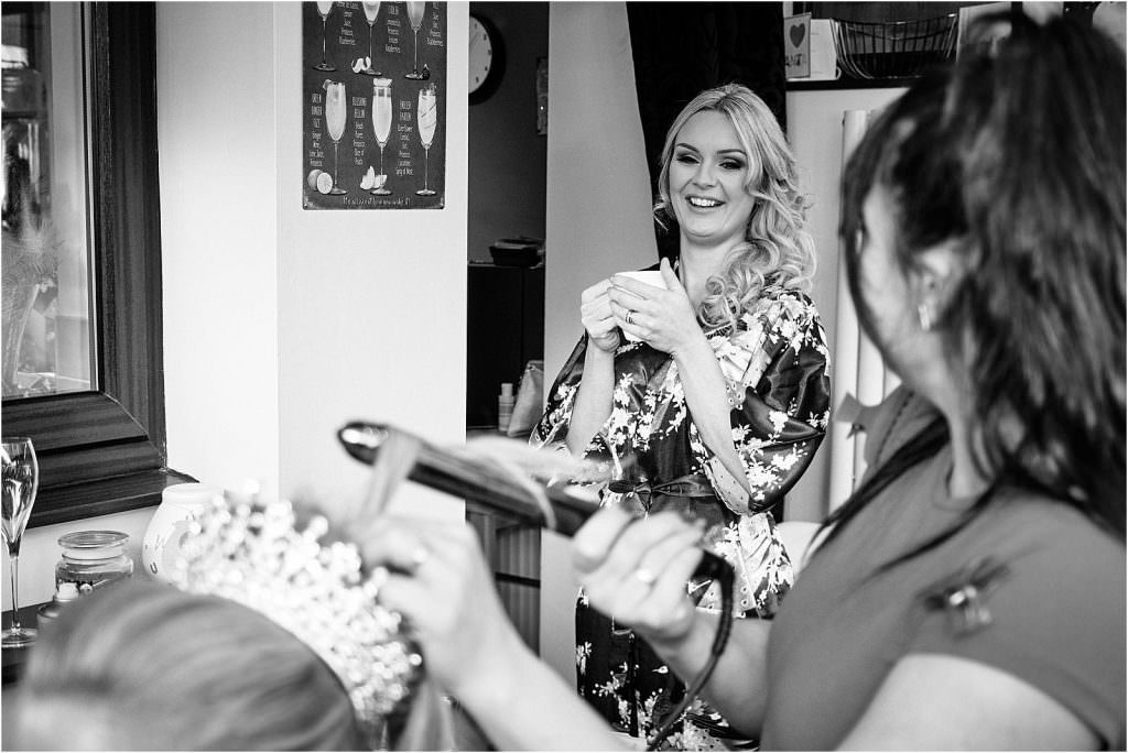 Capturing the bridal party preparations ahead of the wedding at St Michaels Church in Penkridge by Documentary Wedding Photographer Stuart James