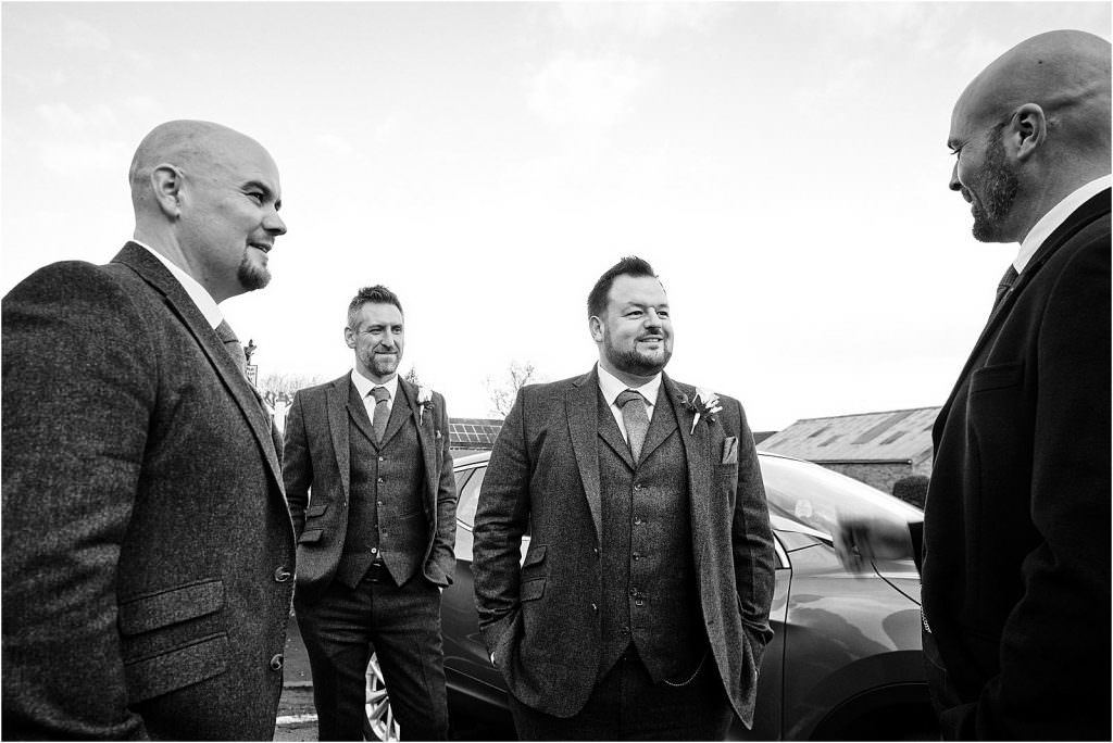 Capturing the arrival of the groomsmen at St Michaels Church in Penkridge by Documentary Wedding Photographer Stuart James