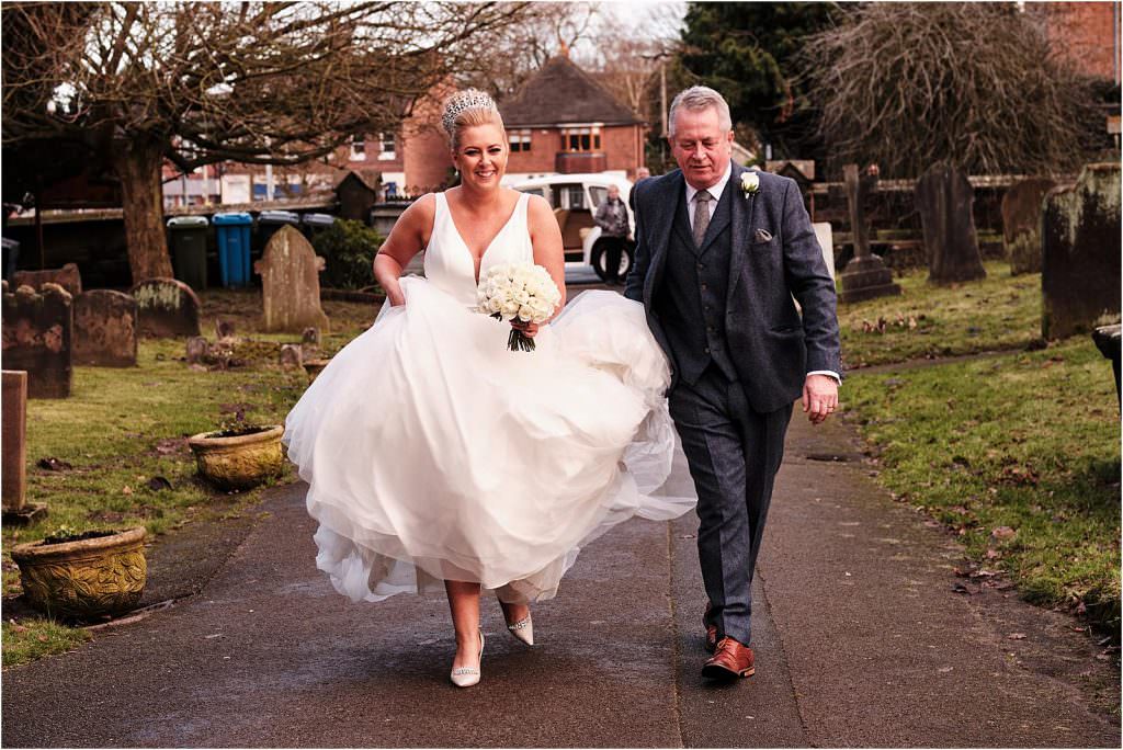 Creative photographs capturing the beautiful bridal party arriving at St Michaels Church in Penkridge by Documentary Wedding Photographer Stuart James