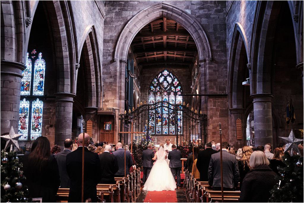The beautiful procession into the wedding ceremony at St Michaels Church in Penkridge by Cannock Wedding Photographer Stuart James