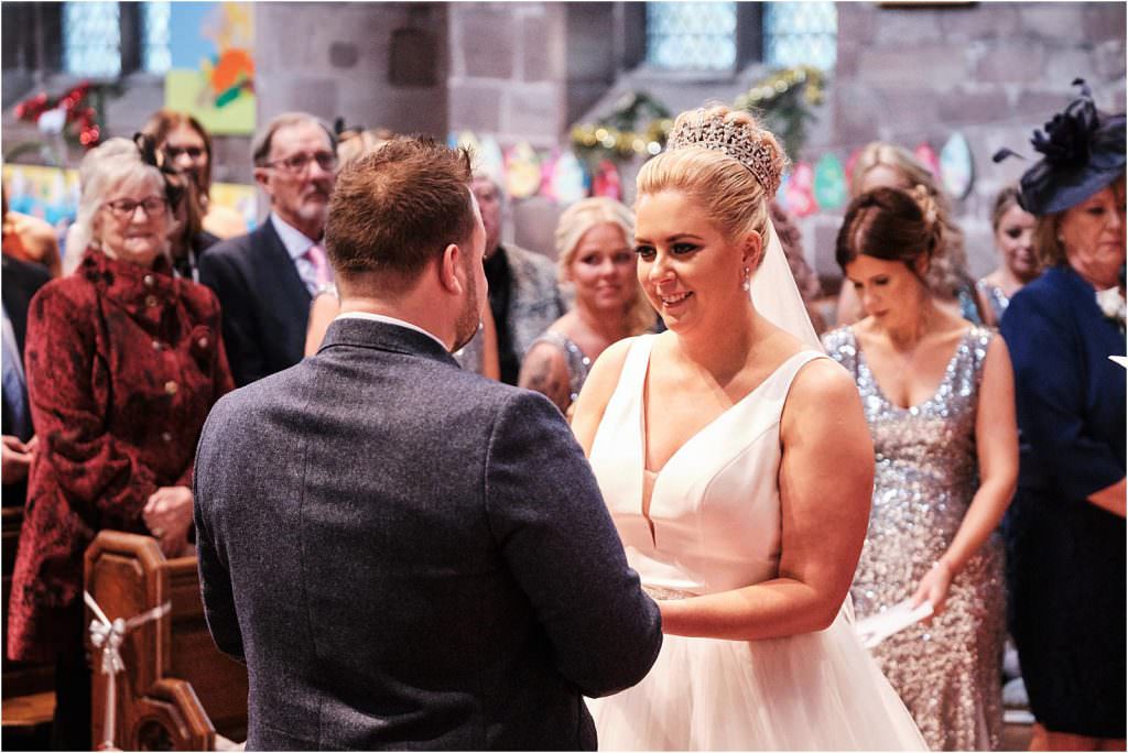 Unobtrusive photos beautifully capturing the wedding ceremony at St Michaels Church in Penkridge by Cannock Wedding Photographer Stuart James