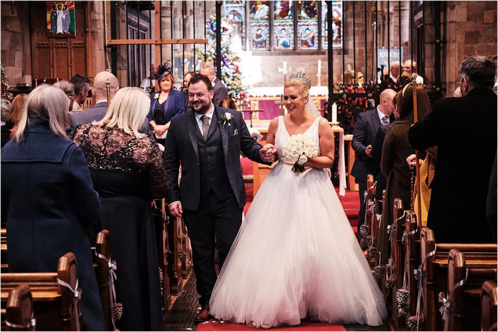 Unobtrusive photos beautifully capturing the wedding ceremony at St Michaels Church in Penkridge by Cannock Wedding Photographer Stuart James