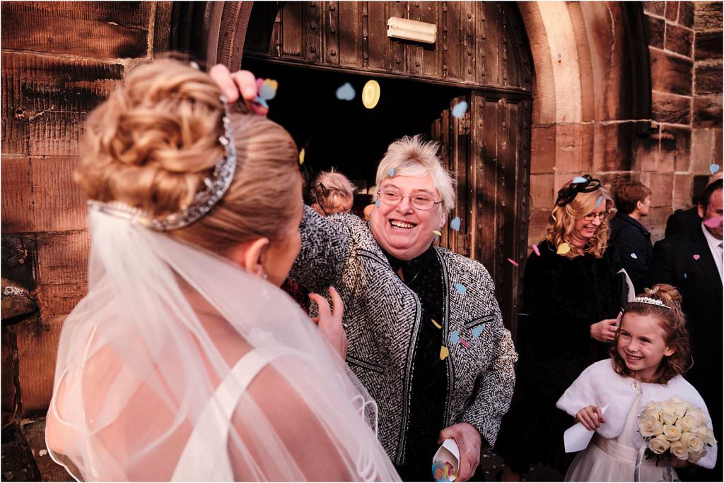Documenting the guests congratulating the newlyweds at St Michaels Church in Penkridge by Cannock Wedding Photographer Stuart James
