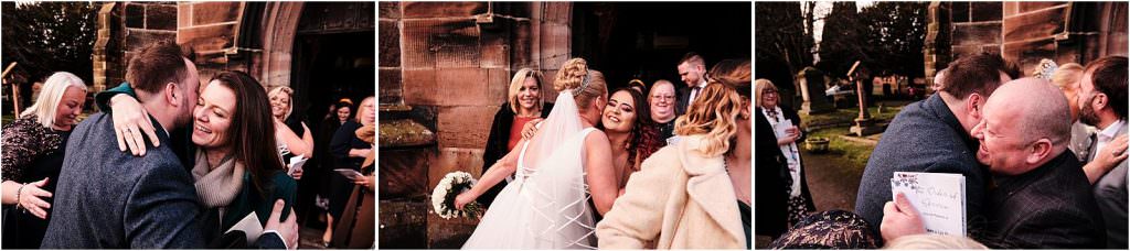 Creative candid photos as the guests congratulate the newlywed at St Michaels Church in Penkridge by Cannock Wedding Photographer Stuart James