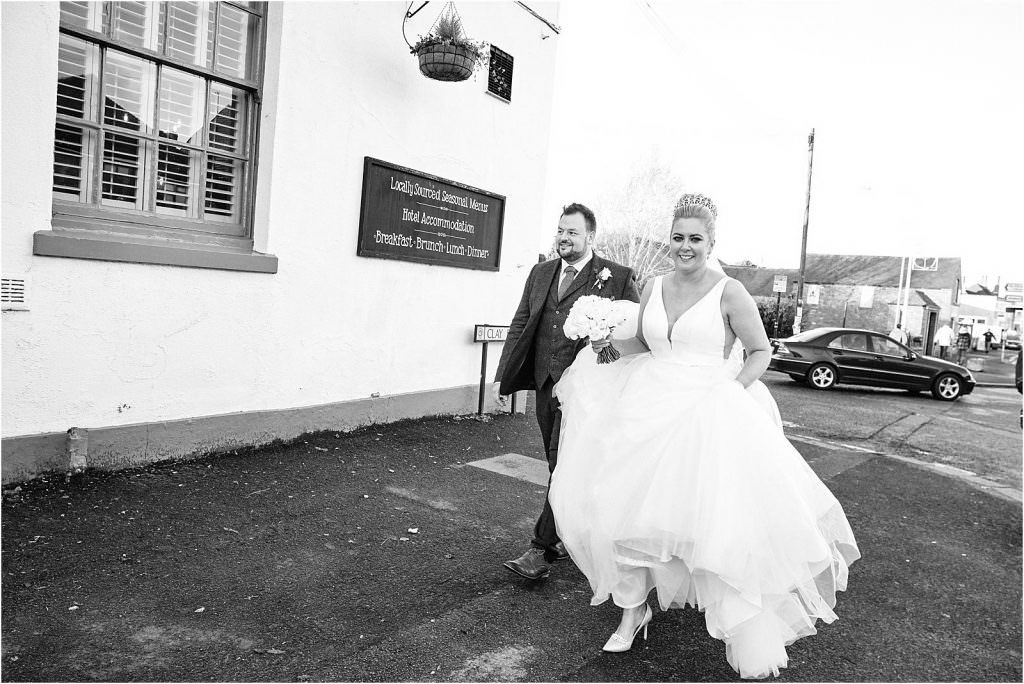 Heading for a swift drink before the wedding reception - St Michaels Church in Penkridge by Cannock Wedding Photographer Stuart James