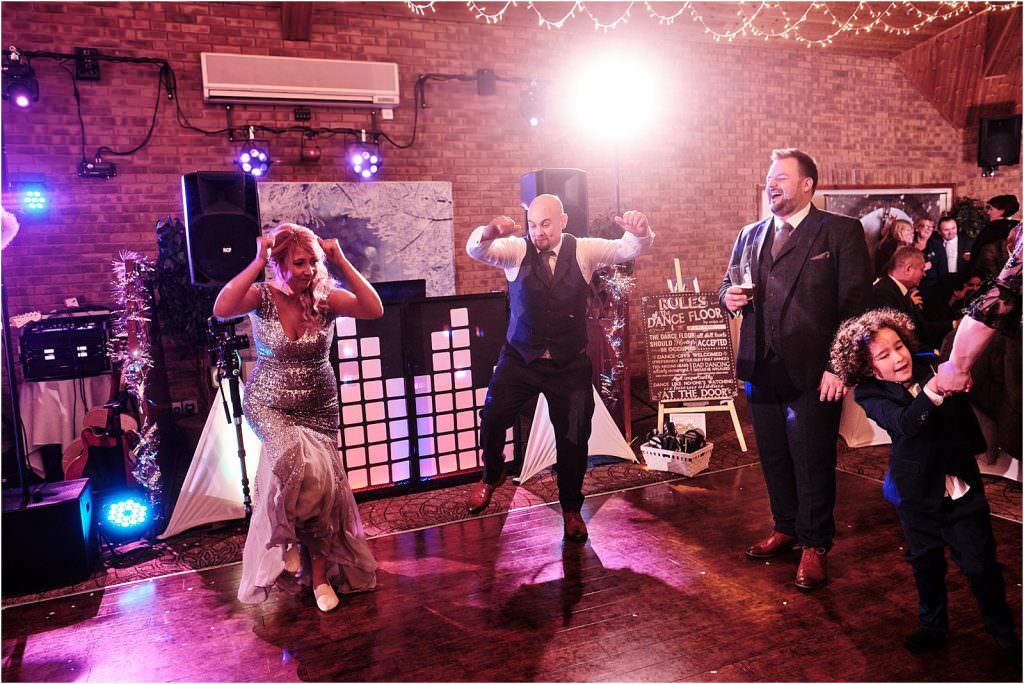 Capturing the guests letting their hair down and having the best time during the band at The Chase in Cannock by Cannock Wedding Photographer Stuart James