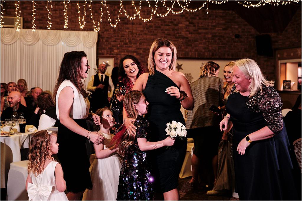 Bouquet toss fun at The Chase in Cannock by Cannock Wedding Photographer Stuart James
