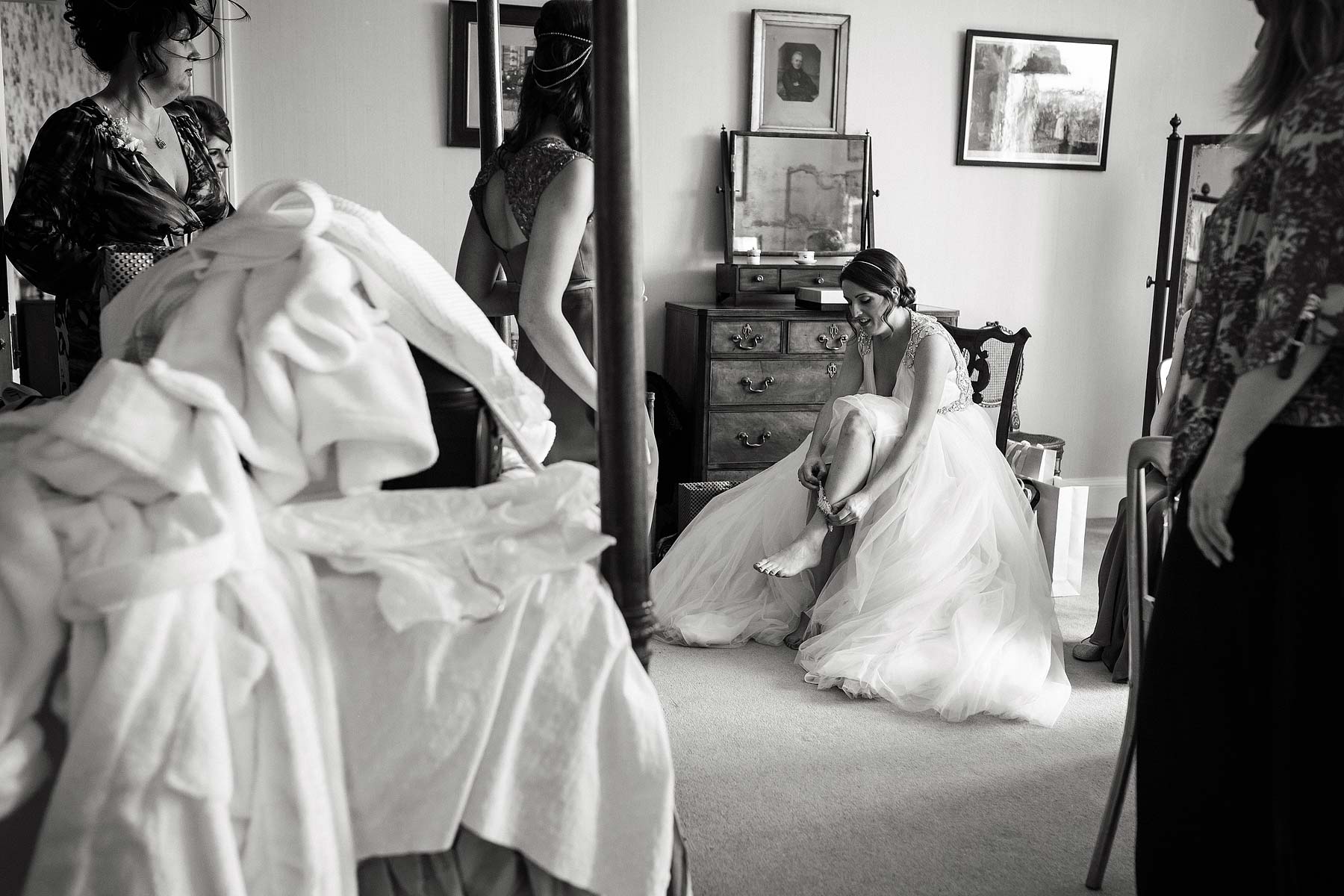 Documentary photographs during the Bridal preparations in the bedroom at Sandon Hall in Stafford by Stafford Documentary Wedding Photographer Stuart James