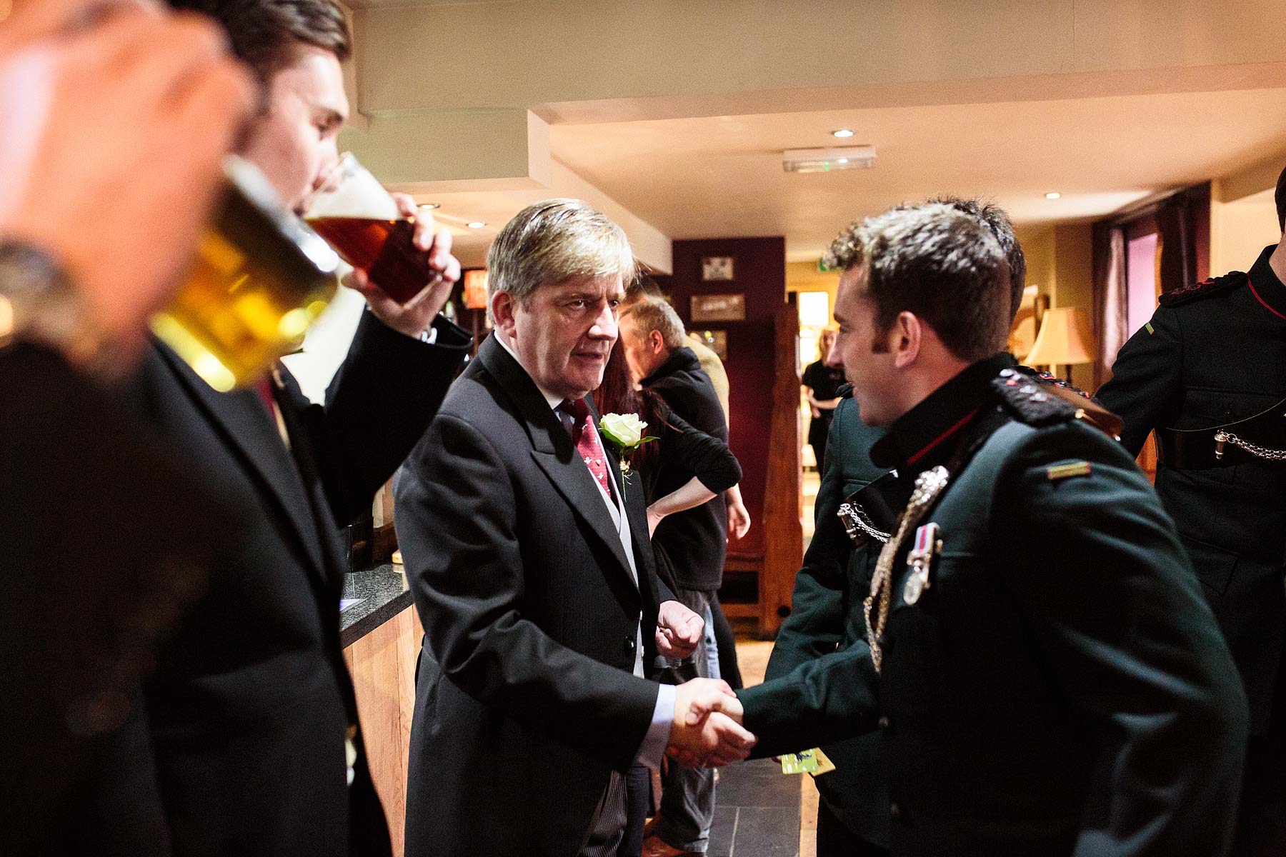 Unobtrusive reportage photography of the groomsmen preparations at The Dog and Doublet in Sandon by Stafford Documentary Wedding Photographer Stuart James
