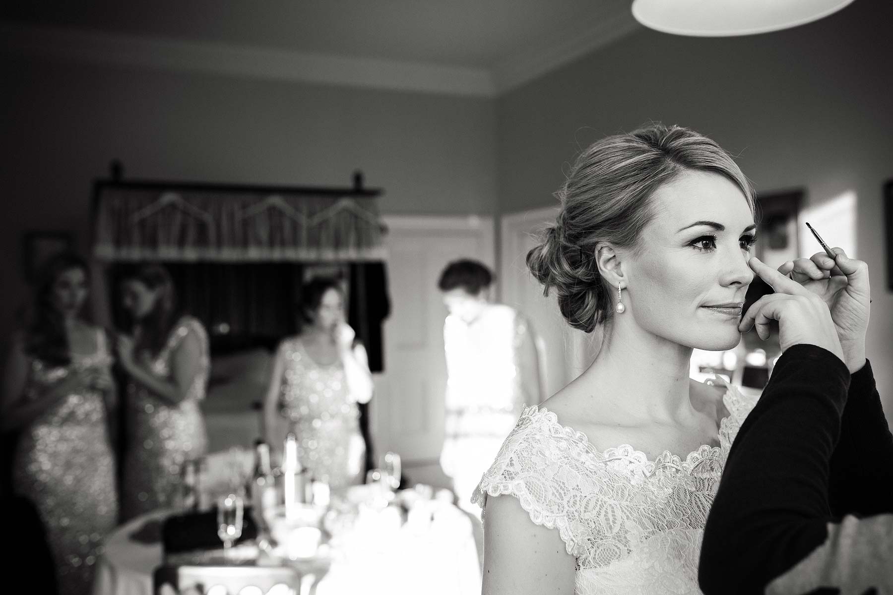 Unobtrusive photography of the bride dressing and final preparations before the wedding at Sandon Hall in Stafford by Stafford Recommended Wedding Photographer Stuart James