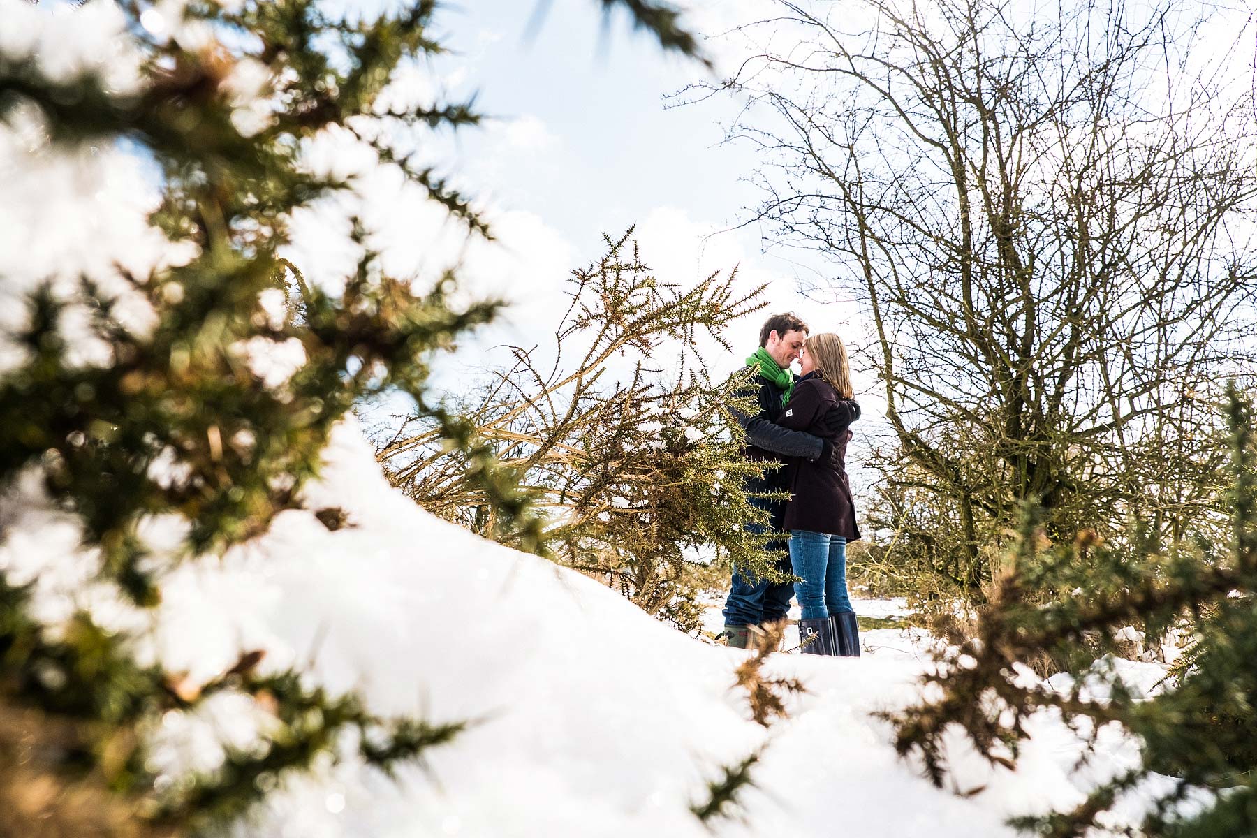 Relaxed engagement shoot on the snowy Cannock Chase in Staffordshire by Stafford Reportage Wedding Photographer Stuart James