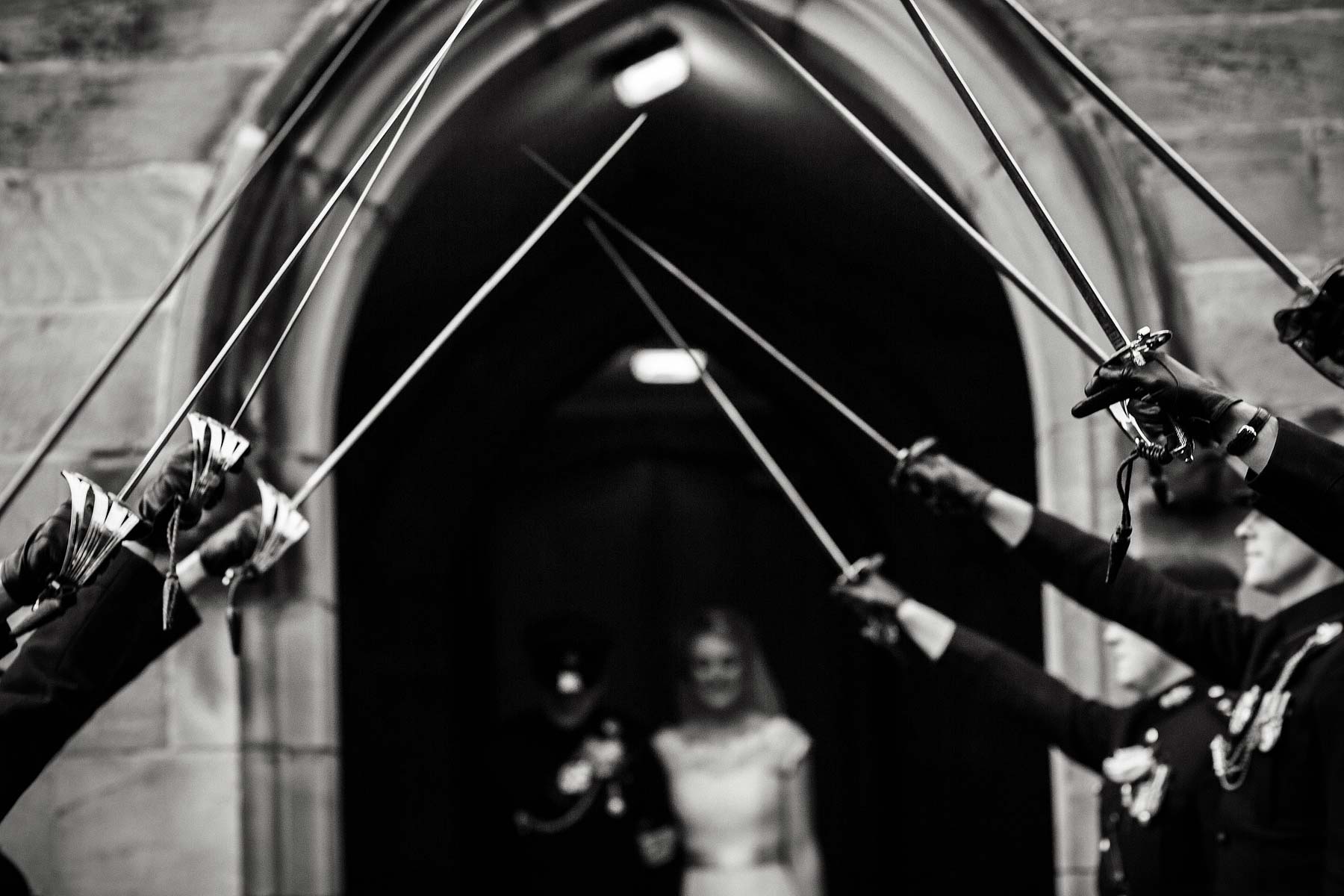 Fabulous guard of honour exit from the church at All Saints Church in Sandon by Staffordshire Documentary Wedding Photographer Stuart James