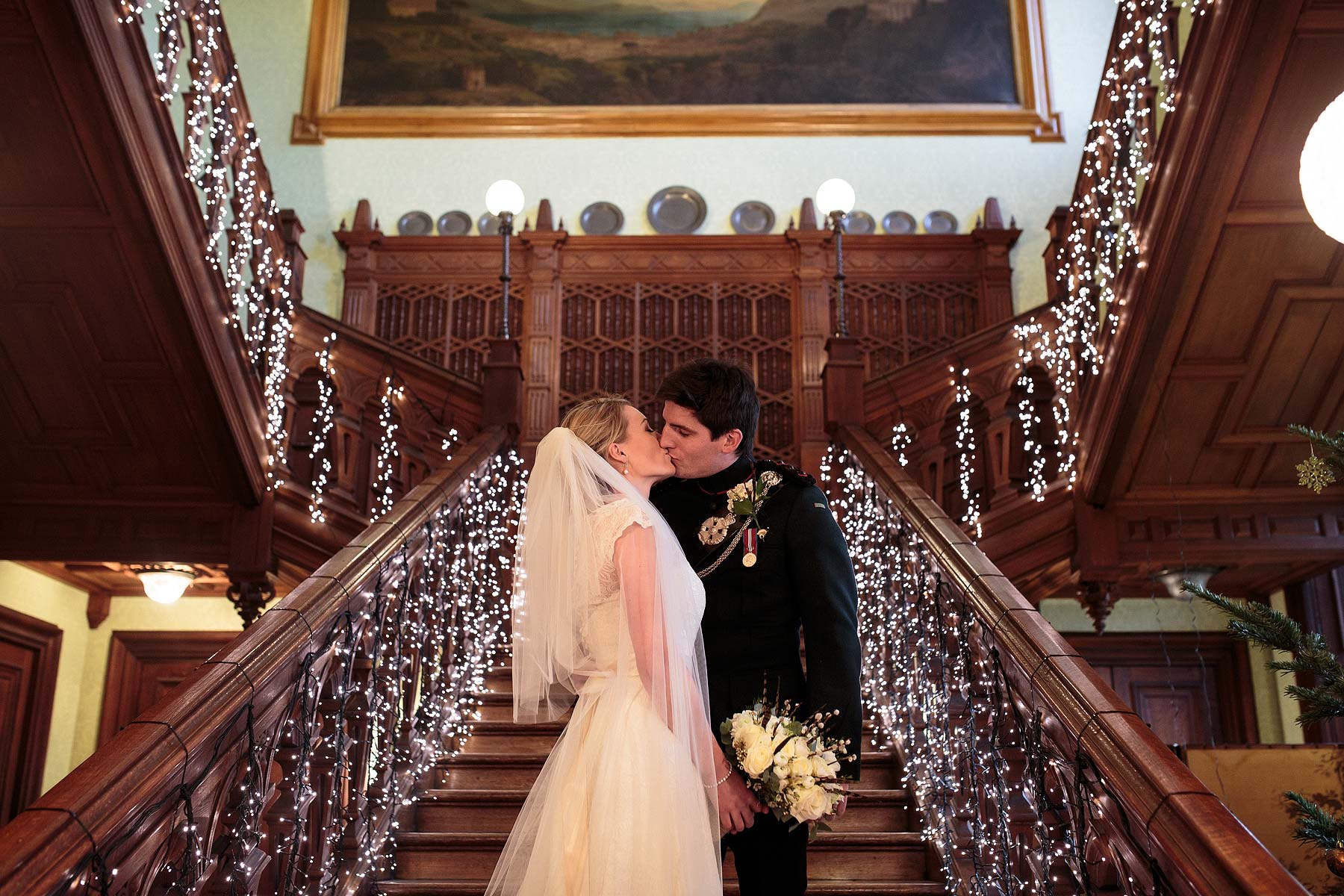 Contemporary intimate portraits on the grand staircase at Sandon Hall in Stafford by Stafford Documentary Wedding Photographer Stuart James