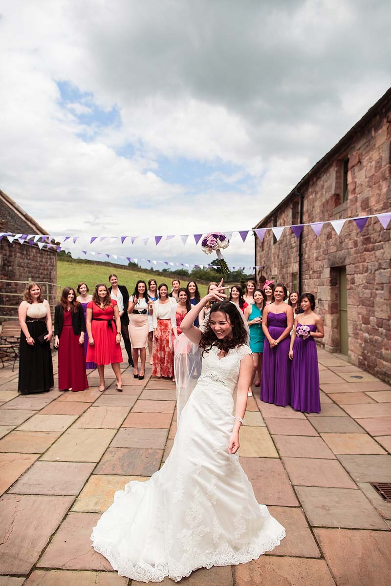 Bouquet toss fun at The Ashes in Endon by Staffordshire Documentary Wedding Photographer Stuart James