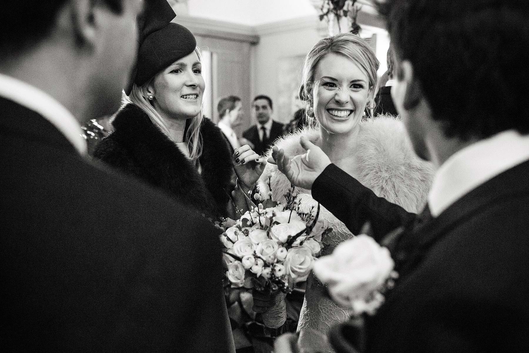 Reportage photos as the guests enjoy the drinks reception in the orangery at Sandon Hall in Stafford by Stafford Conemporary Wedding Photographer Stuart James