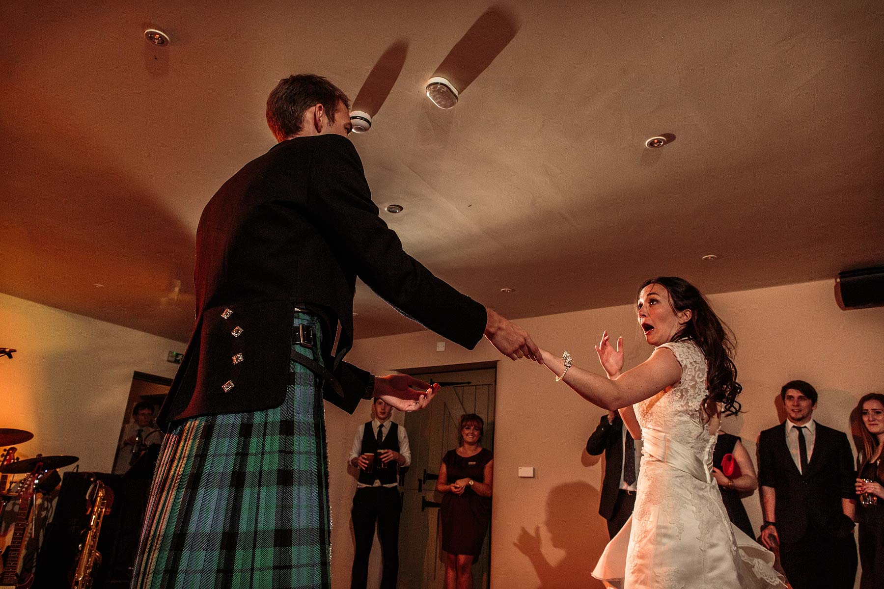 Reportage photos of the wedding reception showing the fun, excitement and laughter during the dancing at The Ashes in Endon by Leek Documentary Wedding Photographer Stuart James