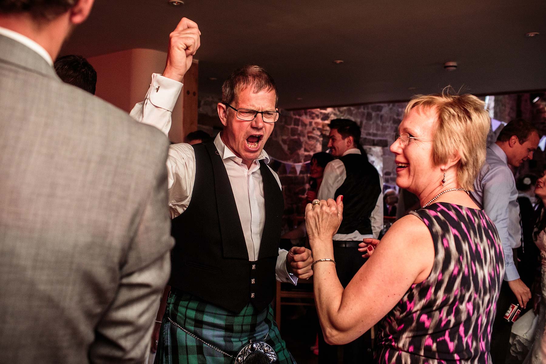 Creative fun photographs of the first dance and evening party at The Ashes in Endon by Leek Documentary Wedding Photographer Stuart James
