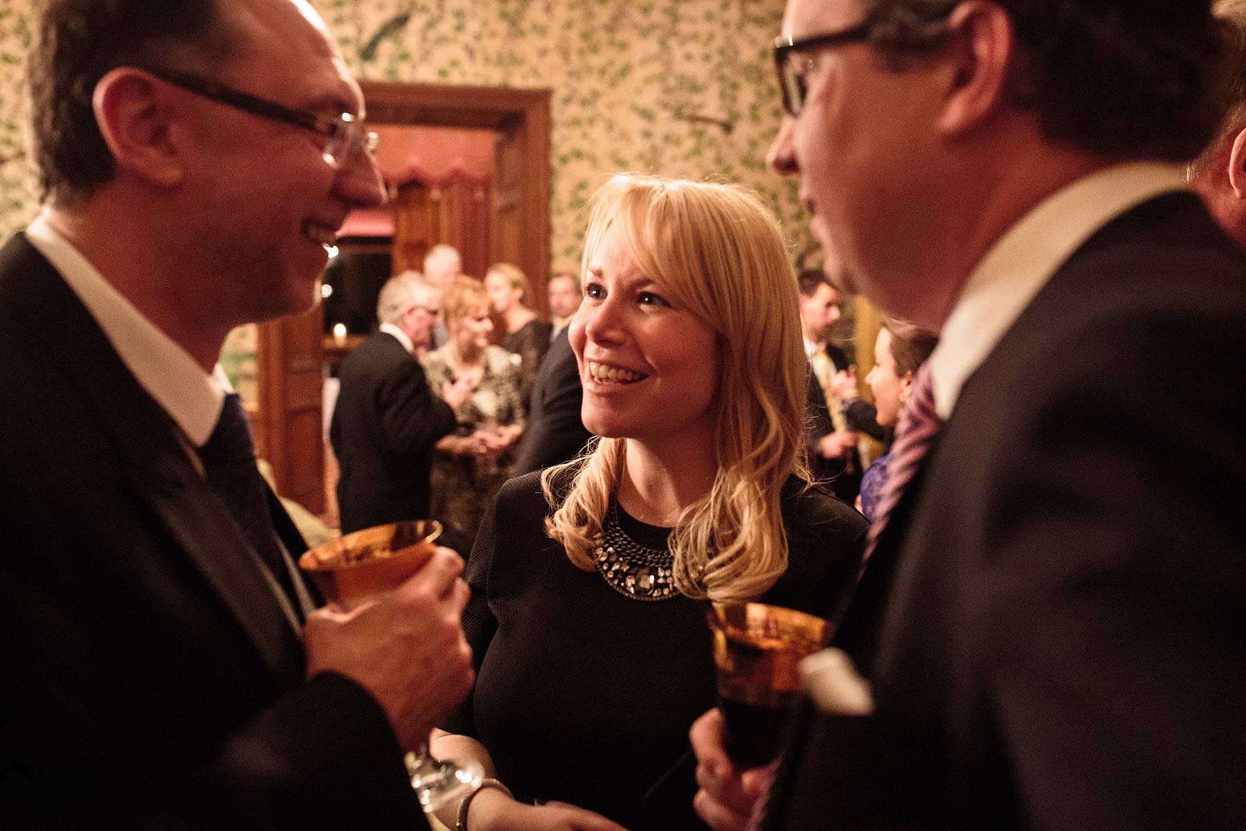 Unobtrusive reportage photography that show the guests enjoying the reception at Sandon Hall in Stafford by Staffordshire Documentary Wedding Photographer Stuart James