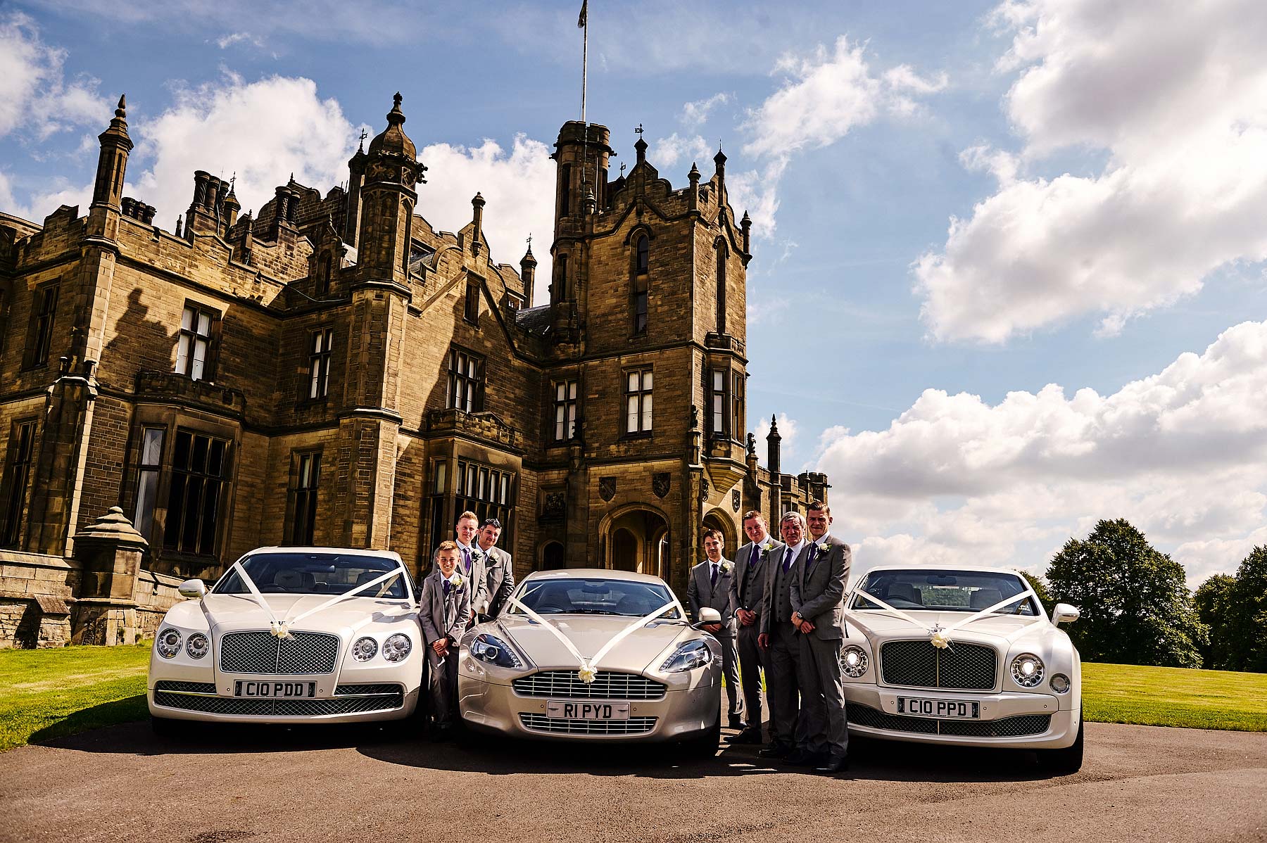 Arriving in style for the wedding at Allerton Castle in Yorkshire by Documentary Wedding Photographer Stuart James