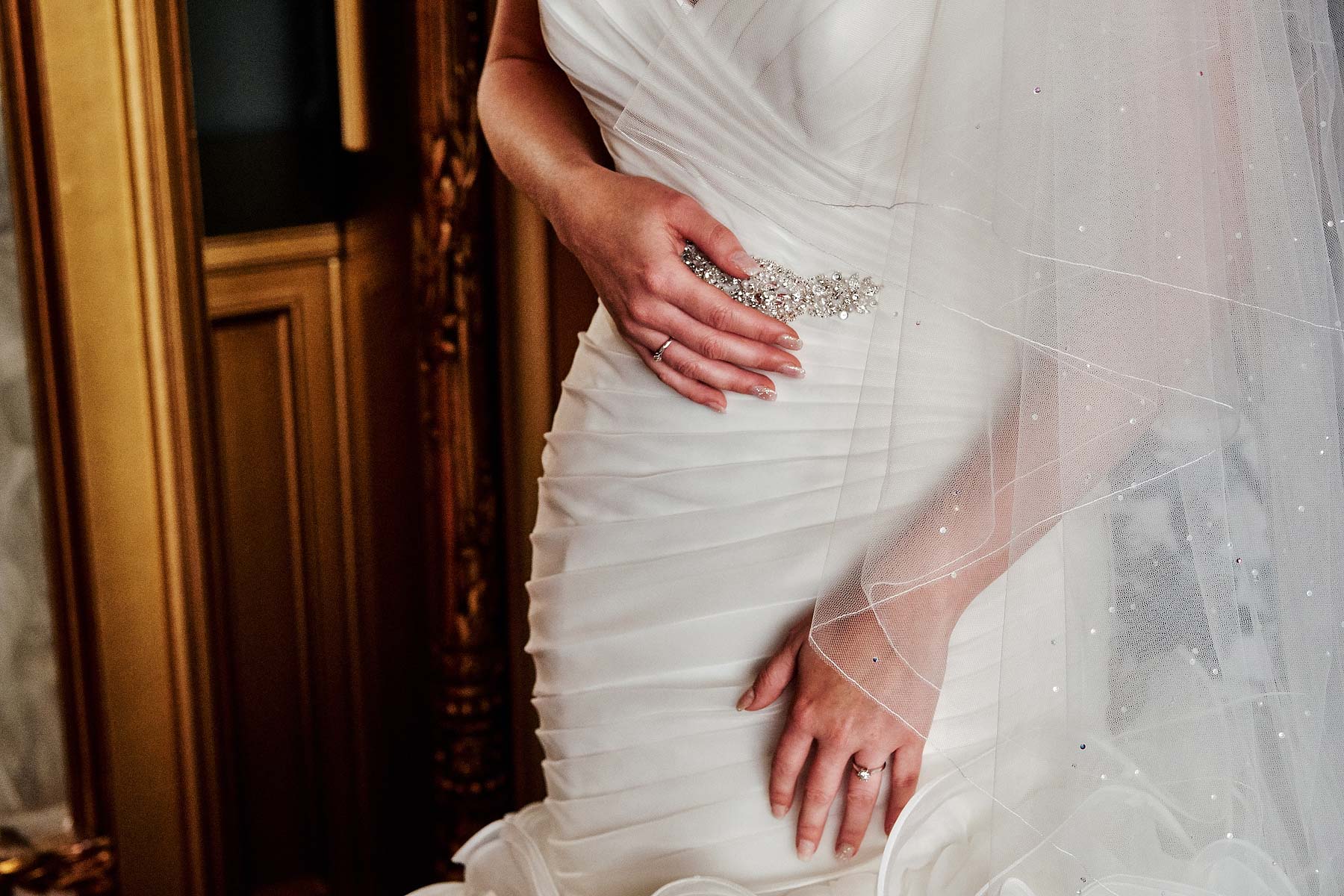 Beautiful and emotional scenes as the bride prepares in her stunning gown at Allerton Castle in Yorkshire by Documentary Wedding Photographer Stuart James