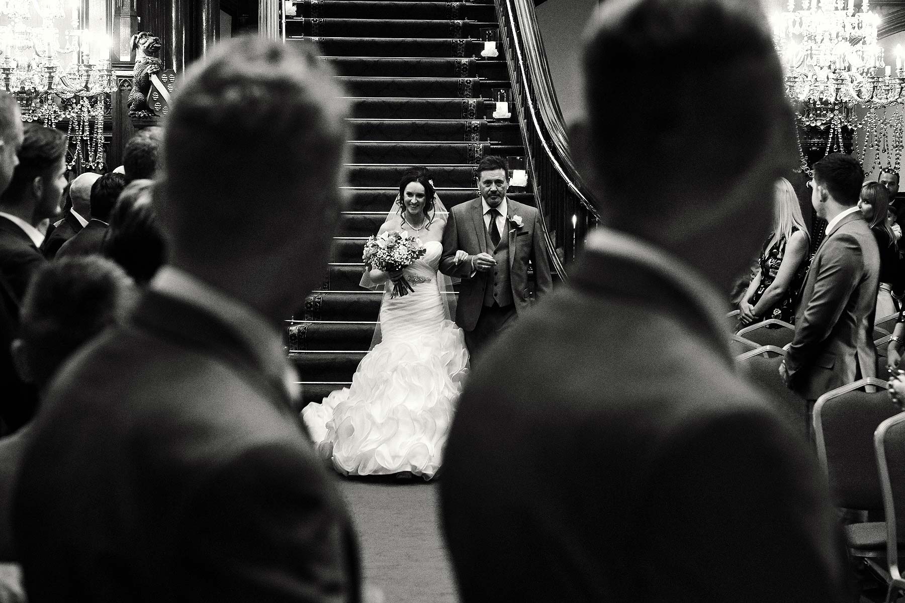 Capturing the truly stunning entrance of the bridal party for the wedding ceremony at Allerton Castle in Yorkshire by Documentary Wedding Photographer Stuart James