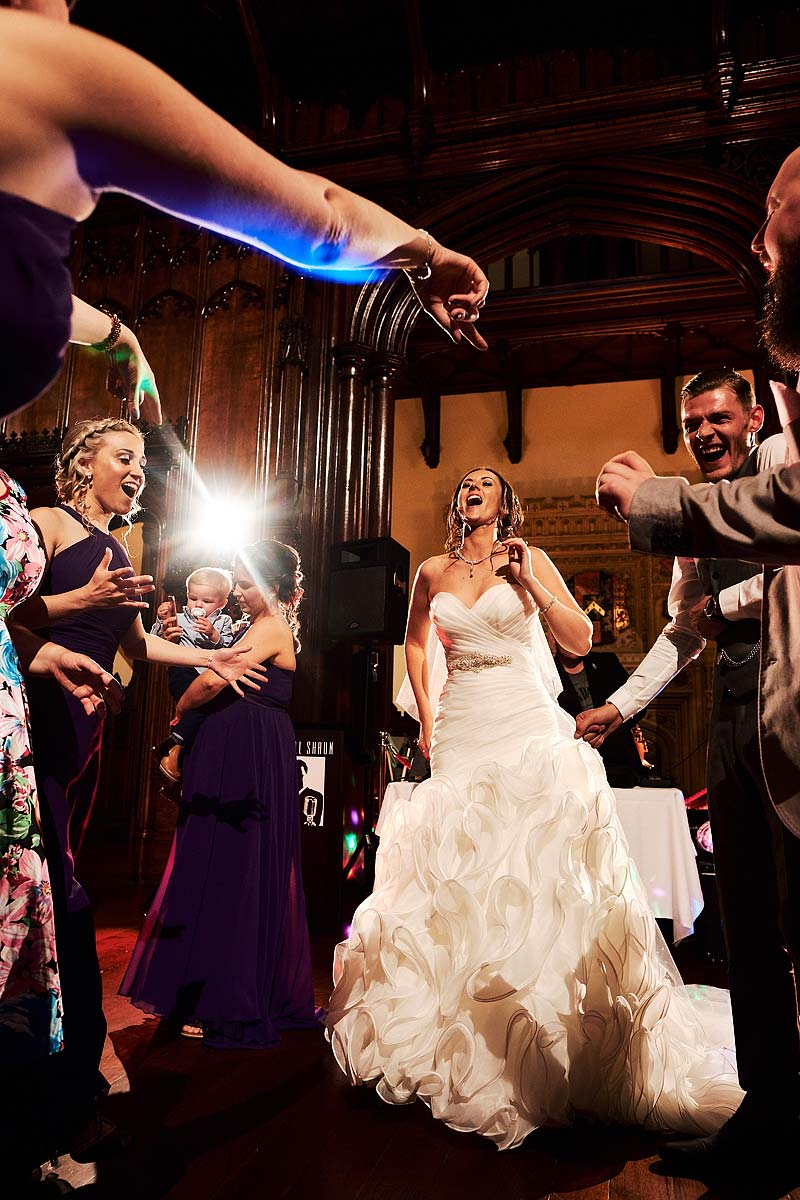 Capturing the fun of the evening reception as the party gets truly underway at Allerton Castle in Yorkshire by Documentary Wedding Photographer Stuart James