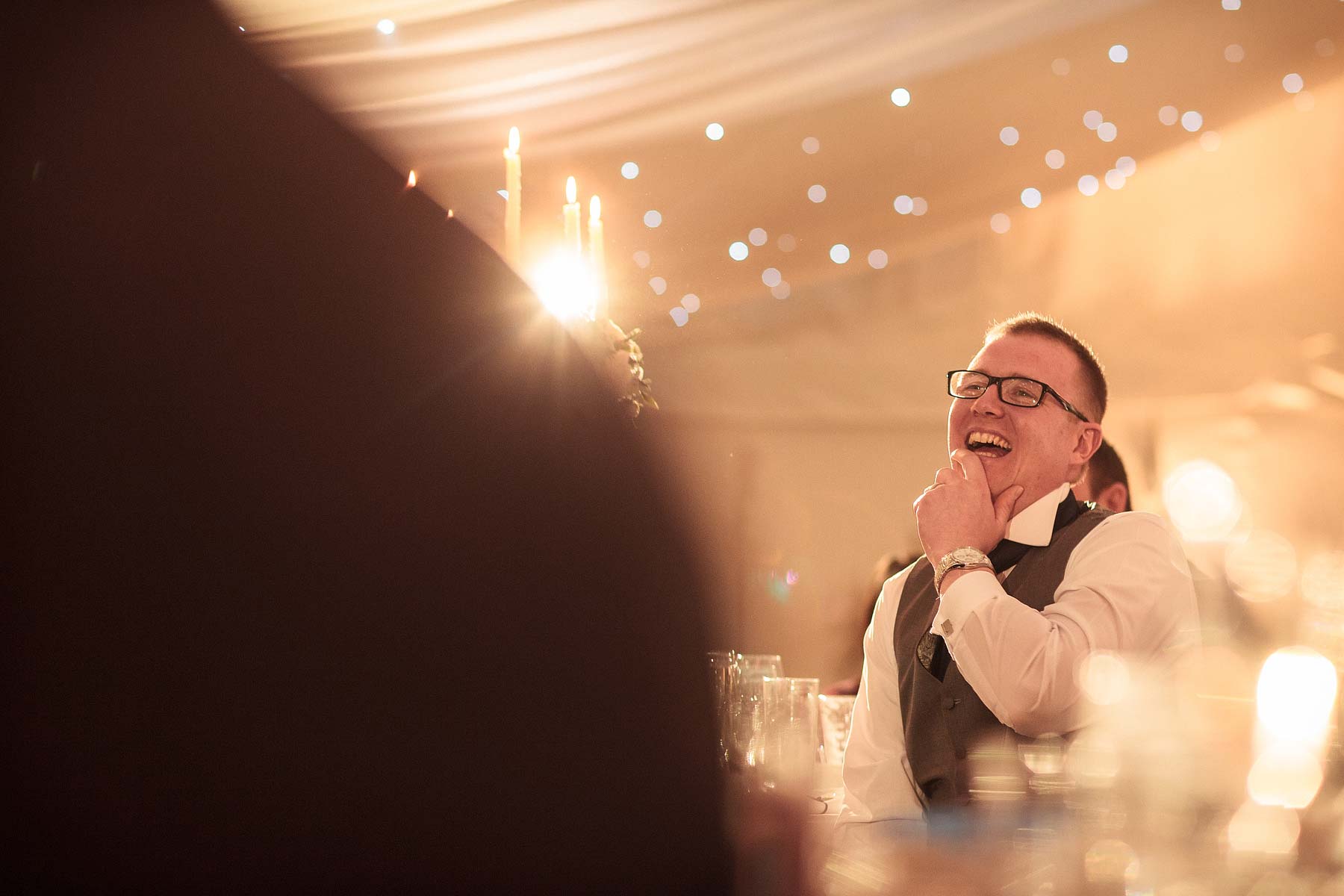 Candid photographs during speeches capturing guest reactions at Chillington Hall in Brewood by Documentary Wedding Photographer Stuart James
