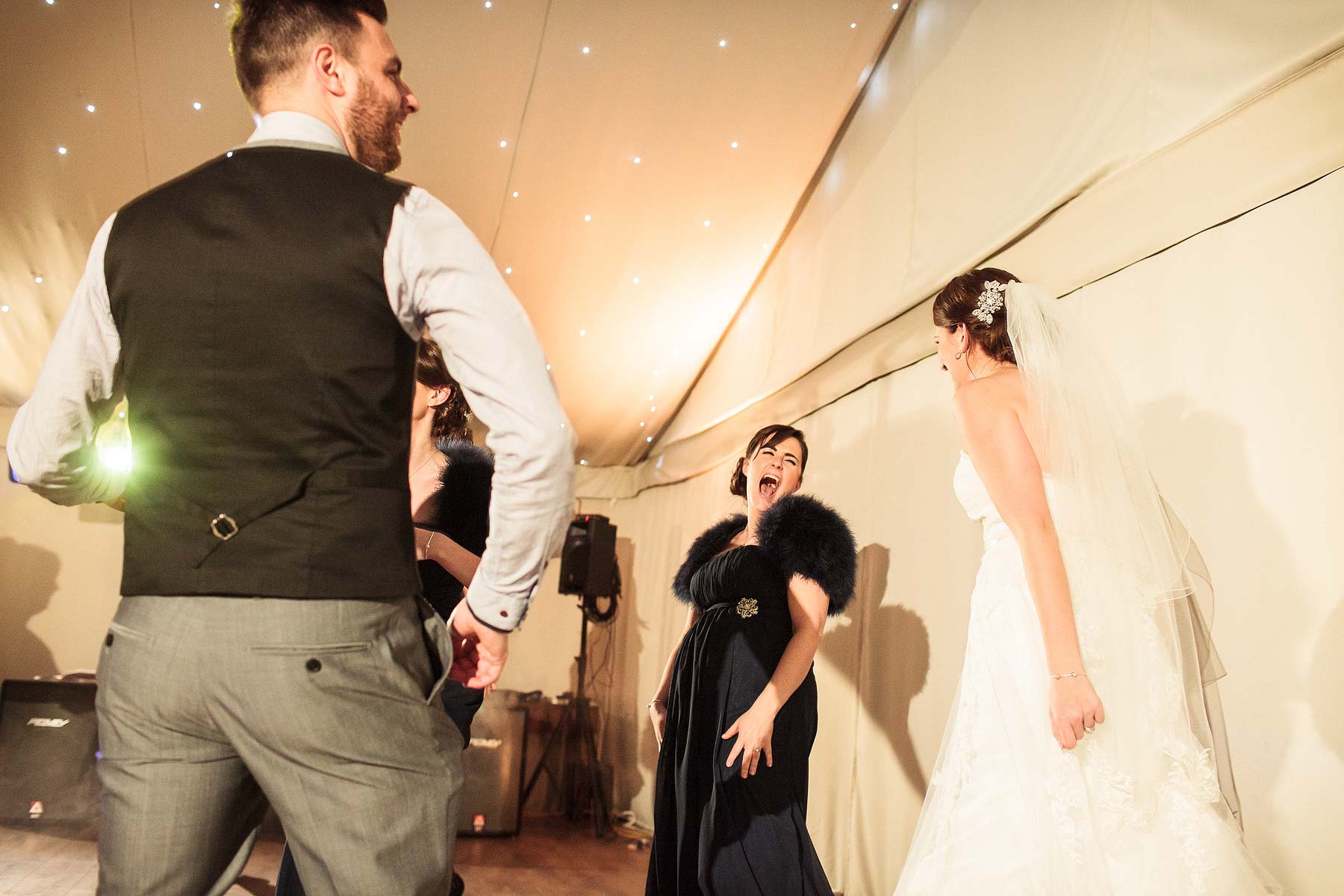 Fun photographs during dancing at Chillington Hall in Brewood by Reportage Wedding Photographer Stuart James