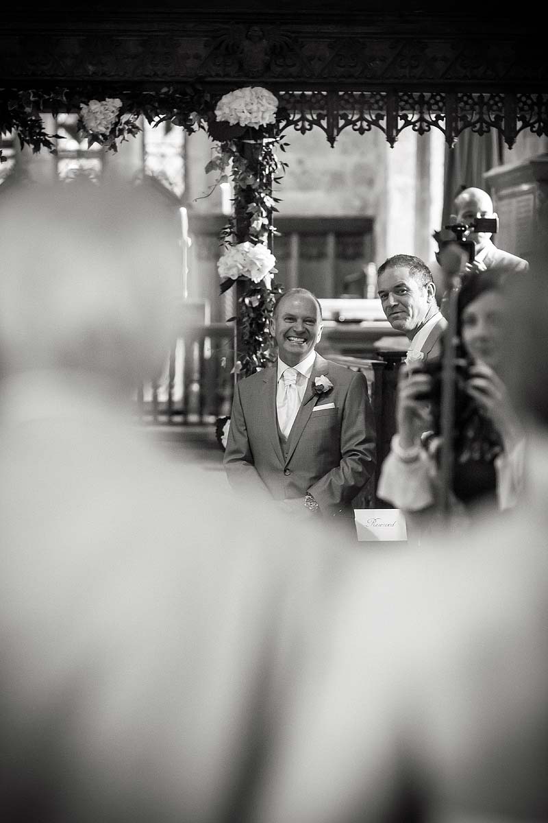 Unobtrusive photographs during wedding ceremony at All Saints Church in Sandon by Staffordshire Wedding Photographer Stuart James