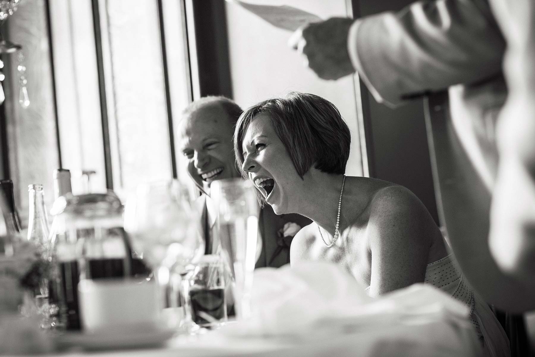 Fantastic reactions to speeches during wedding breakfast at Sandon Hall in Staffordshire by Documentary Wedding Photographer Stuart James