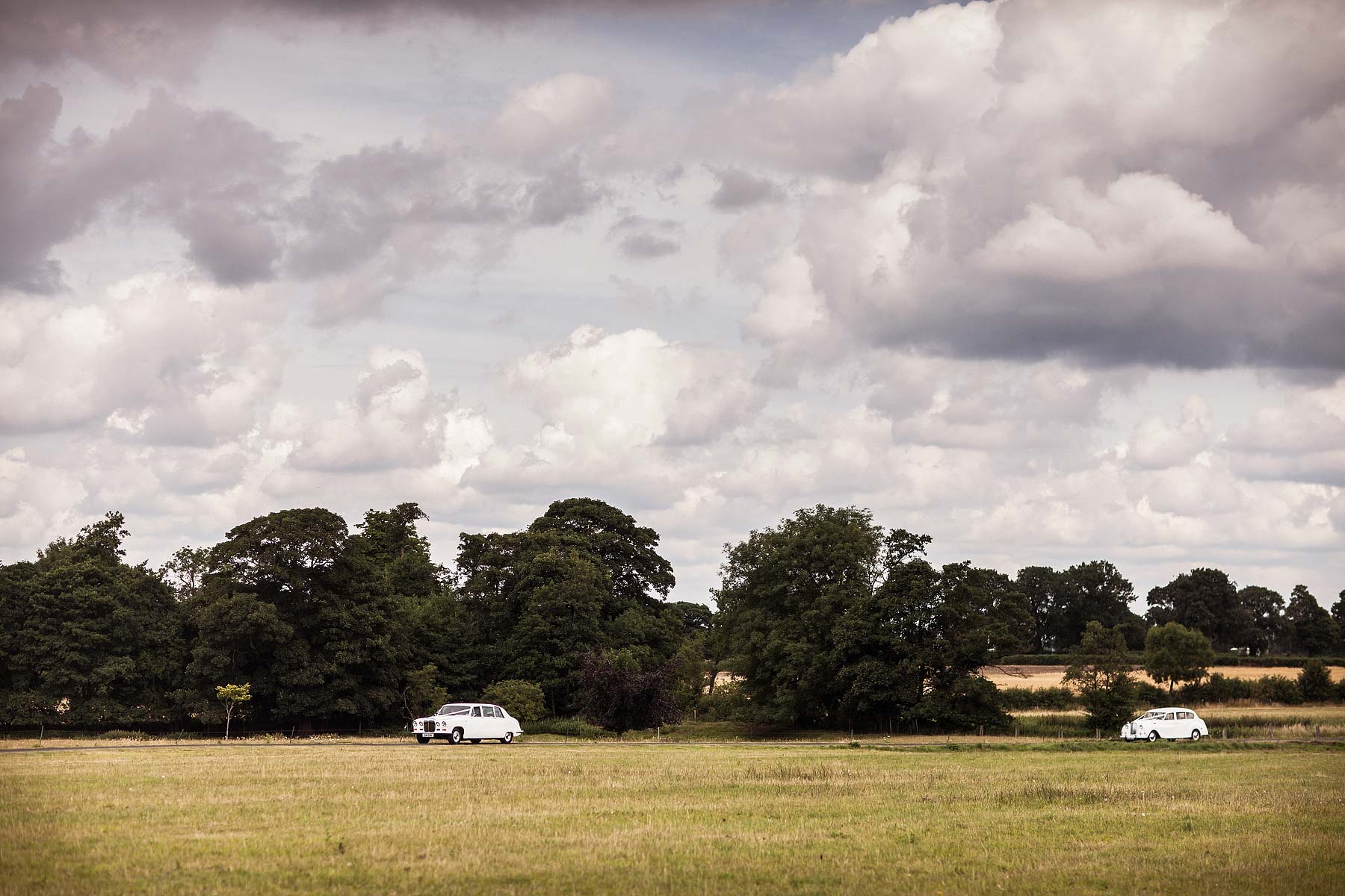 Wedding cars for wedding at Somerford Hall in Brewood by Documentary Wedding Photographer Stuart James