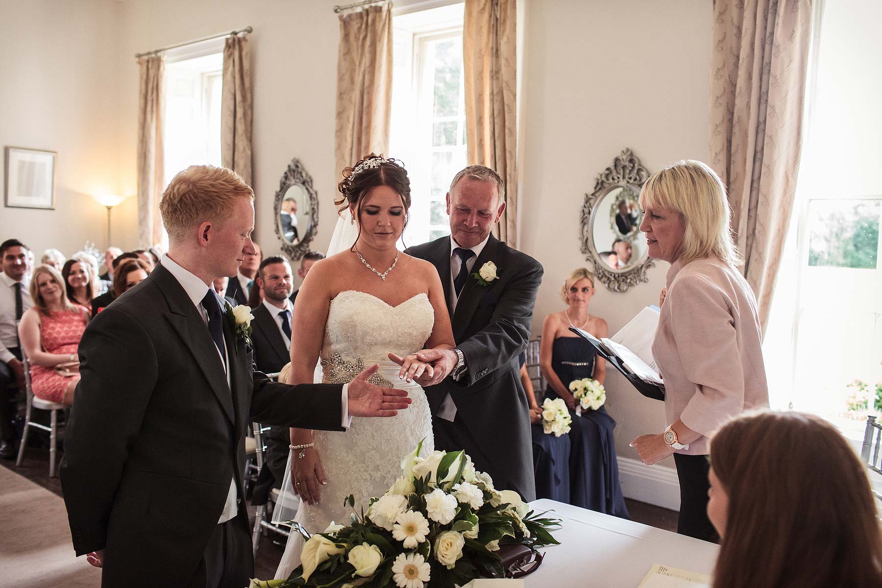 Emotional wedding ceremony entrance at Somerford Hall in Brewood by Documentary Wedding Photographer Stuart James