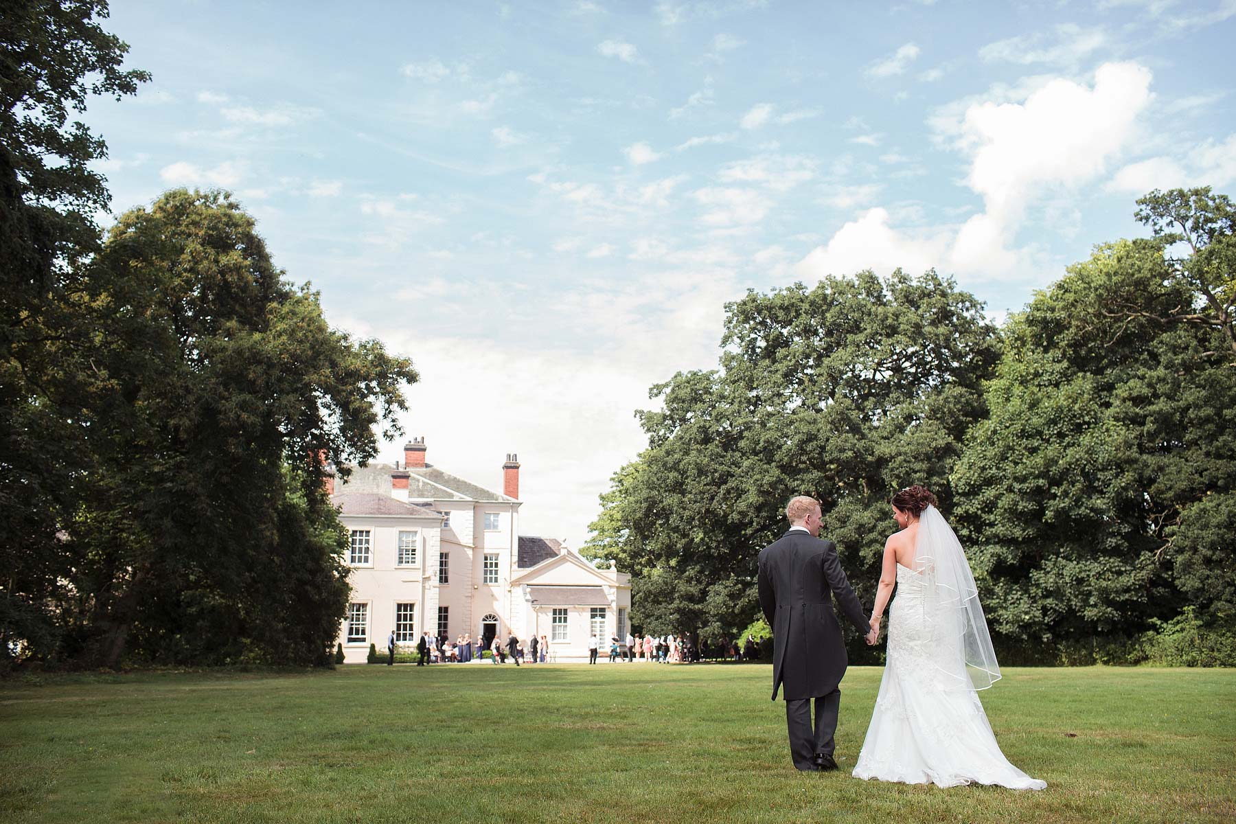 Stunning portraits of Bride and groom around gardens at Somerford Hall in Brewood by Somerford Hall Wedding Photographers Stuart James