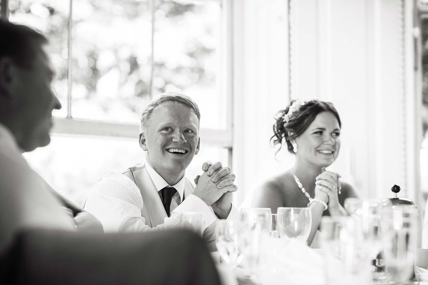 Capturing the guests reactions to the brilliant speeches at Somerford Hall in Brewood by Reportage Wedding Photographer Stuart James