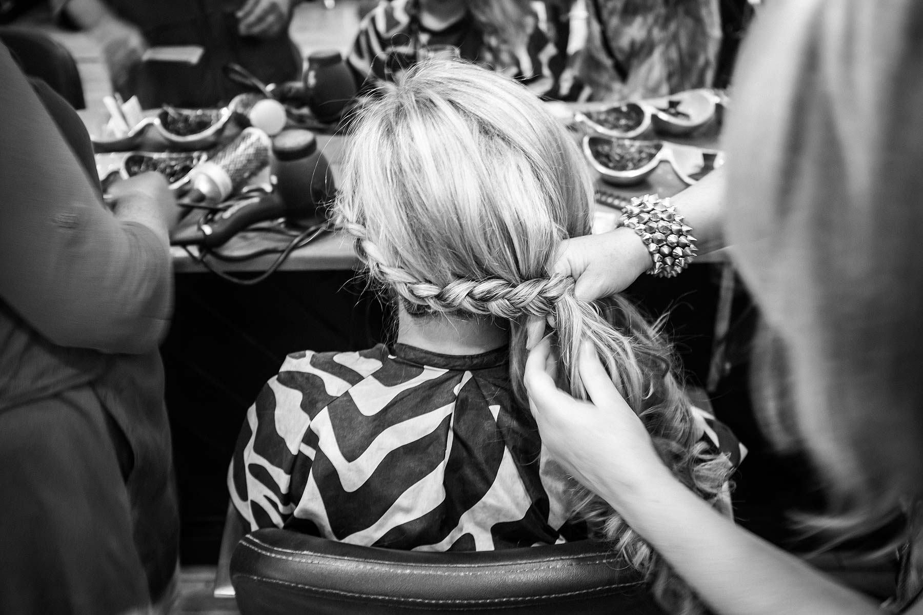 Capturing photos showing the detail of the bridal hair at Weston Park in Staffordshire by Documentary Wedding Photographer Stuart James